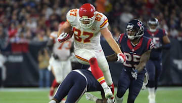 Jan 9, 2016; Houston, TX, USA; Kansas City Chiefs tight end Travis Kelce (87) leaps over Houston Texans cornerback Johnathan Joseph (24) in the third quarter in a AFC Wild Card playoff football game at NRG Stadium. Mandatory Credit: Kirby Lee-USA TODAY Sports