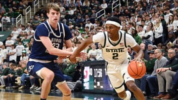 Nov 28, 2023; East Lansing, Michigan, USA; Michigan State Spartans guard Tyson Walker (2) drives past Georgia Southern Eagles forward Nate Brafford (23) during the second half at Jack Breslin Student Events Center. Mandatory Credit: Dale Young-USA TODAY Sports