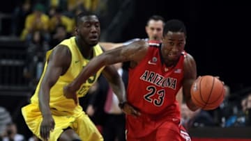 Mar 8, 2014; Eugene, OR, USA; Arizona Wildcats forward Rondae Hollis-Jefferson (23) dribbles the ball past Oregon Ducks forward Richard Amardi (13) at Matthew Knight Arena. Mandatory Credit: Scott Olmos-USA TODAY Sports