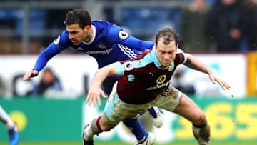 BURNLEY, ENGLAND - FEBRUARY 12: Ashley Barnes of Burnley and Cesc Fabregas of Chelsea in action during the Premier League match between Burnley and Chelsea at Turf Moor on February 12, 2017 in Burnley, England. (Photo by Clive Brunskill/Getty Images)