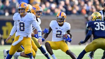 SOUTH BEND, IN - OCTOBER 13: Maurice Ffrench #2 of the Pittsburgh Panthers runs witht the ball behind Kenny Pickett #8 of the Pittsburgh Panthers to avoid a tackle from TaRiq Bracy #35 of the Notre Dame Fighting Irish at Notre Dame Stadium on October 13, 2018 in South Bend, Indiana. (Photo by Quinn Harris/Getty Images)