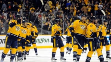 Jan 6, 2015; Nashville, TN, USA; Nashville Predators players celebrate after a win against the Carolina Hurricanes at Bridgestone Arena. The Predators won 3-2. Mandatory Credit: Christopher Hanewinckel-USA TODAY Sports