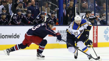 Nov 17, 2015; Columbus, OH, USA; Columbus Blue Jackets left wing Rene Bourque (18) attempts a play at the puck against St. Louis Blues defenseman Alex Pietrangelo (27) in the third period at Nationwide Arena. The Blue Jackets won 3-1. Mandatory Credit: Aaron Doster-USA TODAY Sports