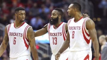 Mar 4, 2015; Houston, TX, USA; Houston Rockets forward Terrence Jones (6) and guard James Harden (13) and center Joey Dorsey (8) talk after a play during the second quarter against the Memphis Grizzlies at Toyota Center. Mandatory Credit: Troy Taormina-USA TODAY Sports