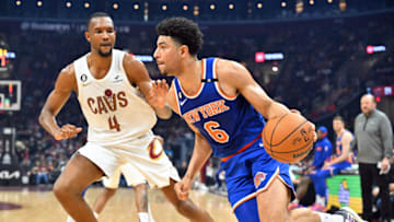 CLEVELAND, OHIO - MARCH 31: Quentin Grimes #6 of the New York Knicks drives to the basket around Evan Mobley #4 of the Cleveland Cavaliers during the first quarter at Rocket Mortgage Fieldhouse on March 31, 2023 in Cleveland, Ohio. NOTE TO USER: User expressly acknowledges and agrees that, by downloading and or using this photograph, User is consenting to the terms and conditions of the Getty Images License Agreement. (Photo by Jason Miller/Getty Images)