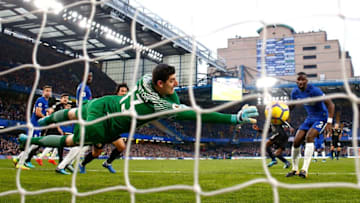 LONDON, ENGLAND - JANUARY 13: Thibaut Courtois of Chelsea dives to make a save during the Premier League match between Chelsea and Leicester City at Stamford Bridge on January 13, 2018 in London, England. (Photo by Clive Rose/Getty Images)