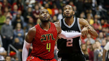 Jan 1, 2017; Atlanta, GA, USA; Atlanta Hawks forward Paul Millsap (4) boxes out San Antonio Spurs forward Kawhi Leonard (2) in overtime at Philips Arena. The Hawks won 114-112 in overtime. Mandatory Credit: Brett Davis-USA TODAY Sports