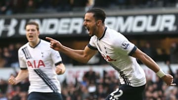 Tottenham Hotspur's Belgian midfielder Nacer Chadli (R) celebrates after scoring their first goal during the English Premier League football match between Tottenham Hotspur and Swansea City at White Hart Lane in London, on February 28, 2016.Tottenham won the game 2-1. / AFP / JUSTIN TALLIS / RESTRICTED TO EDITORIAL USE. No use with unauthorized audio, video, data, fixture lists, club/league logos or 'live' services. Online in-match use limited to 75 images, no video emulation. No use in betting, games or single club/league/player publications. / (Photo credit should read JUSTIN TALLIS/AFP/Getty Images)