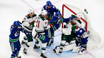 EDMONTON, ALBERTA - AUGUST 02: J.T. Miller #9 of the Vancouver Canucks fights with Kevin Fiala #22 of the Minnesota Wild in Game One of the Western Conference Qualification Round prior to the 2020 NHL Stanley Cup Playoffs at Rogers Place on August 02, 2020 in Edmonton, Alberta, Canada. (Photo by Jeff Vinnick/Getty Images)