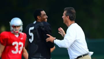 Aug 19, 2013; Columbus, OH, USA; Ohio State Buckeyes head coach Urban Meyer and quarterback Braxton Miller (5) during practice at Ackerman Road Field. Mandatory Credit: Andrew Weber-USA TODAY Sports