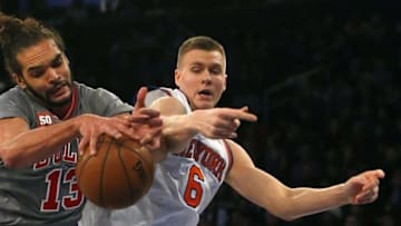 Dec 19, 2015; New York, NY, USA; Chicago Bulls center Joakim Noah (13) and New York Knicks forward Kristaps Porzingis (6) battle for a rebound during the first half at Madison Square Garden. Mandatory Credit: Noah K. Murray-USA TODAY Sports