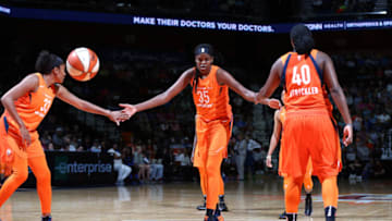 UNCASVILLE, CT - JUNE 9: Jonquel Jones #35 of the Connecticut Sun exchanges handshakes with teammates Morgan Tuck #33 and Shekinna Stricklen #40 during the game against the Minnesota Lynx on June 9, 2018 at the Mohegan Sun Arena in Uncasville, Connecticut. NOTE TO USER: User expressly acknowledges and agrees that, by downloading and/or using this Photograph, user is consenting to the terms and conditions of the Getty Images License Agreement. Mandatory Copyright Notice: Copyright 2018 NBAE (Photo by Chris Marion/NBAE via Getty Images)