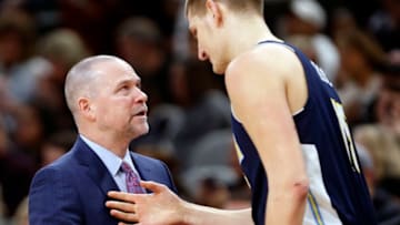 SAN ANTONIO,TX - JANUARY 30: Head coach Michael Malone of Denver Nuggets talks with Nikola Jokic