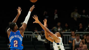 Shai Gilgeous-Alexander #2 of the OKC Thunder shoots the ball against Giannis Antetokounmpo #34 of the Milwaukee Bucks . (Photo by Patrick McDermott/Getty Images)