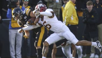 IOWA CITY, IOWA- NOVEMBER 16: Wide receiver Nico Ragaini #89 of the Iowa Hawkeyes rushes in a touchdown during the first half past defensive back Chris Williamson #6 of the Minnesota Gophers on November 16, 2019 at Kinnick Stadium in Iowa City, Iowa. (Photo by Matthew Holst/Getty Images)