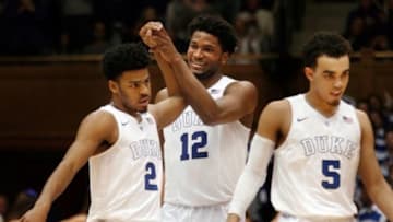 Feb 28, 2015; Durham, NC, USA; Duke Blue Devils guard Quinn Cook (2) and forward Justise Winslow (12) react as they head into a timeout in their game against the Syracuse Orange at Cameron Indoor Stadium. Mandatory Credit: Mark Dolejs-USA TODAY Sports