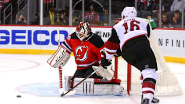 Oct 25, 2016; Newark, NJ, USA; New Jersey Devils goalie Cory Schneider (35) makes a save on Arizona Coyotes left wing Max Domi (16) during the first period at Prudential Center. Mandatory Credit: Ed Mulholland-USA TODAY Sports