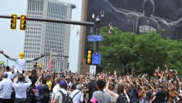 Jun 22, 2016; Cleveland, OH, USA; Cleveland Cavaliers forward LeBron James, left in yellow cap, celebrates during the NBA championship parade in downtown Cleveland. Mandatory Credit: David Richard-USA TODAY Sports