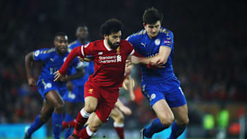 LIVERPOOL, ENGLAND - DECEMBER 30: Mohamed Salah of Liverpool breaks past Harry Maguire of Leicester City to score his team's second goal during the Premier League match between Liverpool and Leicester City at Anfield on December 30, 2017 in Liverpool, England. (Photo by Clive Brunskill/Getty Images)