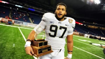 Dec 26, 2013; Detroit, MI, USA; Pittsburgh Panthers defensive lineman Aaron Donald (97) holds the lineman of the game trophy after defeating Bowling Green Falcons 30-27 to win the Little Caesars Pizza Bowl at Ford Field. Mandatory Credit: Andrew Weber-USA TODAY Sports