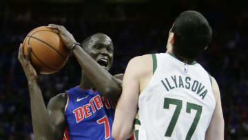 DETROIT, MI - APRIL 20: Thon Maker #7 of the Detroit Pistons collides with Ersan Ilyasova #77 of the Milwaukee Bucks while going to the basket during Game Three of the first round of the 2019 NBA Eastern Conference Playoffs at Little Caesars Arena on April 20, 2019 in Detroit, Michigan. NOTE TO USER: User expressly acknowledges and agrees that, by downloading and or using this photograph, User is consenting to the terms and conditions of the Getty Images License Agreement. (Photo by Duane Burleson/Getty Images)