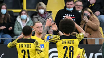 Borussia Dortmund players celebrate Marius Wolf's goal (Photo by INA FASSBENDER/AFP via Getty Images)