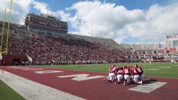 Sep 19, 2015; Bloomington, IN, USA; Members of the Indiana Hoosiers take a knee before the game against the Western Kentucky Hilltoppers at Memorial Stadium. Mandatory Credit: Marc Lebryk-USA TODAY Sports
