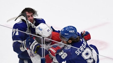 Jun 30, 2021; Tampa, Florida, USA; Montreal Canadiens left wing Phillip Danault (24) is grabbed by Tampa Bay Lightning center Anthony Cirelli (71) and defenseman Mikhail Sergachev (98) during the third period in game two of the 2021 Stanley Cup Final at Amalie Arena. Mandatory Credit: Douglas DeFelice-USA TODAY Sports