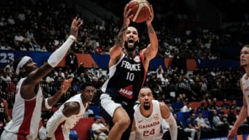 France's shooting guard Evan Fournier (C) lays up a shot to score during the FIBA Basketball World Cup group H match between Canada and France at Indonesia Arena in Jakarta on August 25, 2023. (Photo by Yasuyoshi CHIBA / AFP) (Photo by YASUYOSHI CHIBA/AFP via Getty Images)