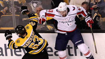 BOSTON - NOVEMBER 4: Boston Bruins left wing Brad Marchand (63) checks Washington Capitals right wing Tom Wilson (43) along the boards during the first period. The Boston Bruins host the Washington Capitals in a regular season NHL hockey game at TD Garden in Boston on Nov. 4, 2017. (Photo by Barry Chin/The Boston Globe via Getty Images)