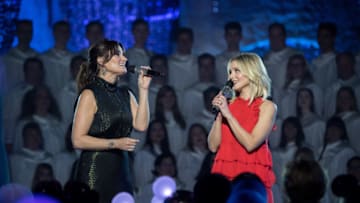 ANAHEIM, CA - NOVEMBER 14: In this handout photo provided by Disney Parks, Idina Menzel and Kristen Bell of 'Frozen' perform during a taping of 'The Wonderful World of Disney: Magical Holiday Celebration' at Sleeping Beauty's Castle at Walt Disneyland on November 14, 2017 in Anaheim, California. 'The Wonderful World of Disney: Magical Holiday Celebration' airs on November 30, 2017. (Photo by Matt Petit/Disney Parks via Getty Images)