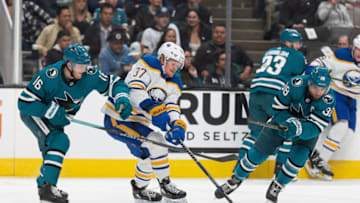 Feb 18, 2023; San Jose, California, USA; San Jose Sharks center Steven Lorentz (16) and San Jose Sharks defenseman Mario Ferraro (38) chase after the puck during the first period against Buffalo Sabres center Casey Mittelstadt (37) at SAP Center at San Jose. Mandatory Credit: Stan Szeto-USA TODAY Sports