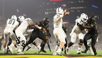 TEMPE, AZ - SEPTEMBER 08: Quarterback Brian Lewerke #14 of the Michigan State Spartans drops back to pass under pressure from linebacker Darien Butler #37 of the Arizona State Sun Devils during the first half of the college football game against the Arizona State Sun Devils at Sun Devil Stadium on September 8, 2018 in Tempe, Arizona. (Photo by Christian Petersen/Getty Images)