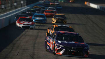 LOUDON, NH - JULY 16: Denny Hamlin, driver of the #11 FedEx Office Toyota, leads the field into turn one during the Monster Energy NASCAR Cup Series Overton's 301 at New Hampshire Motor Speedway on July 16, 2017 in Loudon, New Hampshire. (Photo by Chris Trotman/Getty Images)