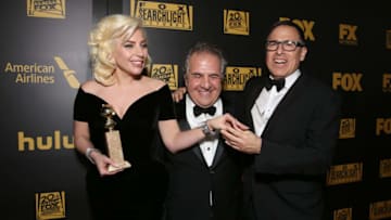 BEVERLY HILLS, CA - JANUARY 10: (L-R) Actress/singer Lady Gaga, winner of Best Performance in a Miniseries or Television Film for 'American Horror Story: Hotel,' Fox Filmed Entertainment Chairman/CEO Jim Gianopulos, and director David O. Russell attend FOX Golden Globe Awards Party 2016 sponsored by American Airlines at The Beverly Hilton Hotel on January 10, 2016 in Beverly Hills, California. (Photo by Todd Williamson/Getty Images for FOX)