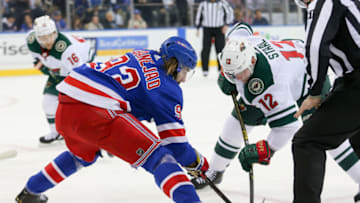 NEW YORK, NY - FEBRUARY 21: New York Rangers Center Mika Zibanejad (93) and Minnesota Wild Center Eric Staal (12) take a face off during the National Hockey League game between the Minnesota Wild and the New York Rangers on February 21, 2019 at Madison Square Garden in New York, NY. (Photo by Joshua Sarner/Icon Sportswire via Getty Images)