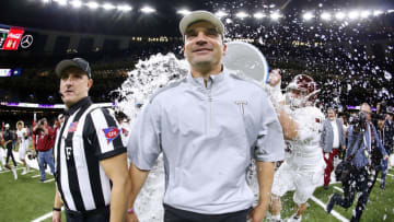 NEW ORLEANS, LA - DECEMBER 16: Head coach Neal Brown of the Troy Trojans is dunked with water after the R+L Carriers New Orleans Bowl against the North Texas Mean Green at the Mercedes-Benz Superdome on December 16, 2017 in New Orleans, Louisiana. The Troy Trojans won 50-30. (Photo by Jonathan Bachman/Getty Images)