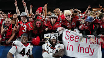 Georgia Bulldogs fans celebrate with Travon Walker and Justin Shaffer after winning the Orange Bowl. (Mandatory Credit: John David Mercer-USA TODAY Sports)