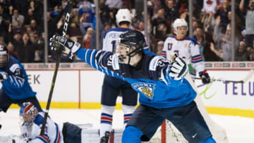 VANCOUVER, BC - JANUARY 5: Kaapo Kakko #24 of Finland celebrates after scoring what proved to be the game winning goal against the United States in Gold Medal hockey action of the 2019 IIHF World Junior Championship on January, 5, 2019 at Rogers Arena in Vancouver, British Columbia, Canada. Ryan Poehling #11, goalie Cayden Primeau #30 and Mikey Anderson #26 of the United States are pictured in the background. (Photo by Rich Lam/Getty Images)