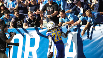 CARSON, CA - NOVEMBER 25: Running back Melvin Gordon #28 of the Los Angeles Chargers celebrates with fans after scoring a touchdown in the second quarter against the Arizona Cardinals at StubHub Center on November 25, 2018 in Carson, California. (Photo by Sean M. Haffey/Getty Images)