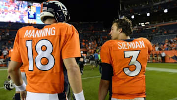 Sep 3, 2015; Denver, CO, USA; Denver Broncos quarterback Peyton Manning (18) and quarterback Trevor Siemian (3) following a preseason game against the Arizona Cardinals at Sports Authority Field at Mile High. The Cardinals defeated the Broncos 22-20. Mandatory Credit: Ron Chenoy-USA TODAY Sports