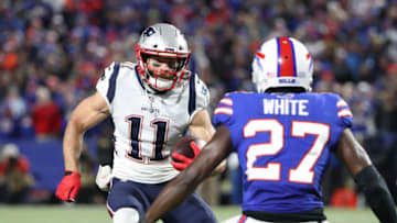 BUFFALO, NY - OCTOBER 29: Julian Edelman #11 of the New England Patriots runs with the ball during NFL game action as TreDavious White #27 of the Buffalo Bills prepares to make the tackle at New Era Field on October 29, 2018 in Buffalo, New York. (Photo by Tom Szczerbowski/Getty Images)