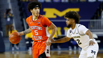 Mar 2, 2021; Ann Arbor, Michigan, USA; Illinois Fighting Illini guard Andre Curbelo (5) dribbles defended by Michigan Wolverines guard Mike Smith (12) in the second half at Crisler Center. Mandatory Credit: Rick Osentoski-USA TODAY Sports