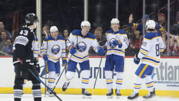 Apr 11, 2023; Newark, New Jersey, USA; Buffalo Sabres defenseman Mattias Samuelsson (23) celebrates his goal with teammates during the third period in front of New Jersey Devils defenseman Luke Hughes (43) at Prudential Center. Mandatory Credit: Vincent Carchietta-USA TODAY Sports