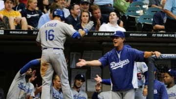 May 20, 2013; Milwaukee, WI, USA; Los Angeles Dodgers manager Don Mattingly (right) congratulates right fielder Andre Ethier (16) after his solo home run in the 4th inning against the Milwaukee Brewers at Miller Park. Mandatory Credit: Benny Sieu-USA TODAY Sports