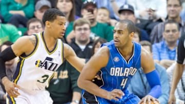 Mar 22, 2014; Salt Lake City, UT, USA; Utah Jazz guard Trey Burke (3) defends against Orlando Magic guard Arron Afflalo (4) during the second half at EnergySolutions Arena. The Jazz won 89-88. Mandatory Credit: Russ Isabella-USA TODAY Sports