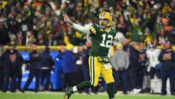 GREEN BAY, WISCONSIN - DECEMBER 12: Aaron Rodgers #12 of the Green Bay Packers reacts after a touchdown pass during the third quarter of the NFL game against the Chicago Bears at Lambeau Field on December 12, 2021 in Green Bay, Wisconsin. (Photo by Quinn Harris/Getty Images)