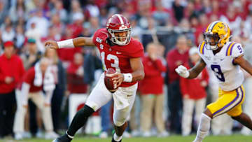 TUSCALOOSA, ALABAMA - NOVEMBER 09: Tua Tagovailoa #13 of the Alabama Crimson Tide attempts to escape pressure from Marcel Brooks #9 of the LSU Tigers during the first half in the game at Bryant-Denny Stadium on November 09, 2019 in Tuscaloosa, Alabama. (Photo by Kevin C. Cox/Getty Images)