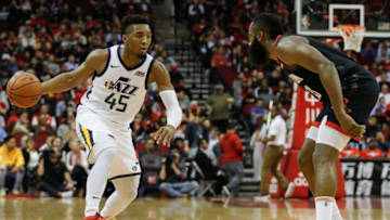 HOUSTON, TX - OCTOBER 24: Donovan Mitchell #45 of the Utah Jazz dribbles the ball defended by James Harden #13 of the Houston Rockets in the first half at Toyota Center on October 24, 2018 in Houston, Texas. (Photo by Tim Warner/Getty Images)