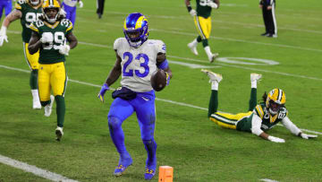 GREEN BAY, WISCONSIN - JANUARY 16: Cam Akers #23 of the Los Angeles Rams converts a two point conversion in the third quarter against the Green Bay Packers during the NFC Divisional Playoff game at Lambeau Field on January 16, 2021 in Green Bay, Wisconsin. (Photo by Stacy Revere/Getty Images)